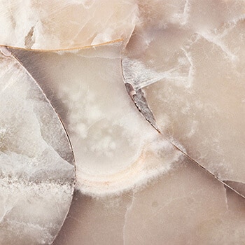Quartz chunk of crystal like stone in a yellow pink color with white pieces